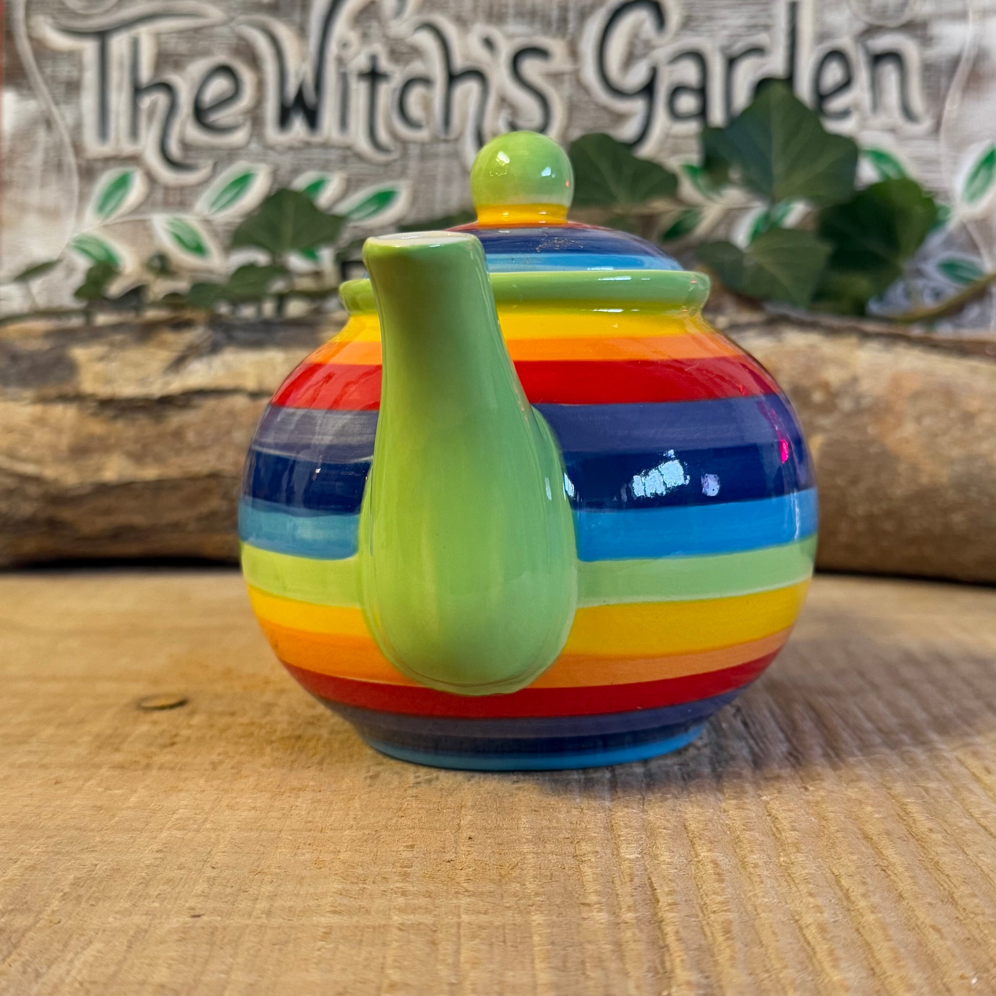 Discover our handcrafted 2-cup ceramic teapot from Thailand, featuring a vibrant rainbow design. Eco-friendly, fair-trade, dishwasher & microwave safe—perfect for elevating your tea rituals with style and sustainability.