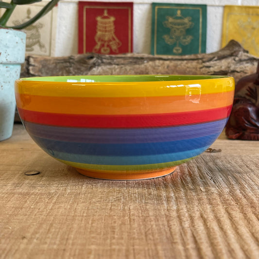 Wonderfully cheerful happy &amp; bright, this rainbow stripe ceramic bowl brightens up any home. The vibrant stripes are hand painted giving each piece individual character.  Size: 15 x 7cm  Handmade and Fairtrade from Thailand  Dishwasher and Microwave safe  Note: As these side plates are hand painted slight variations in pattern and colour can occur.