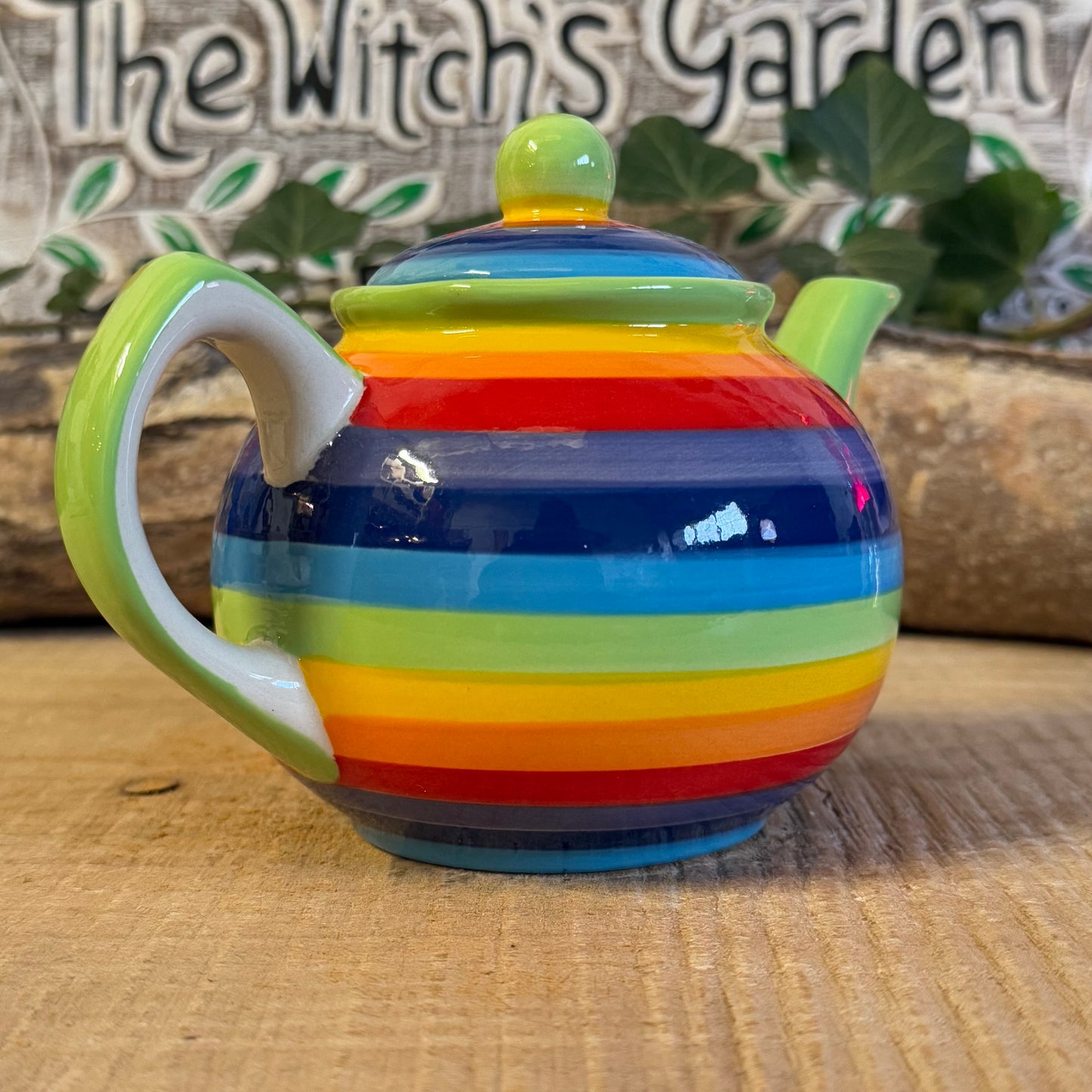 Discover our handcrafted 2-cup ceramic teapot from Thailand, featuring a vibrant rainbow design. Eco-friendly, fair-trade, dishwasher & microwave safe—perfect for elevating your tea rituals with style and sustainability.