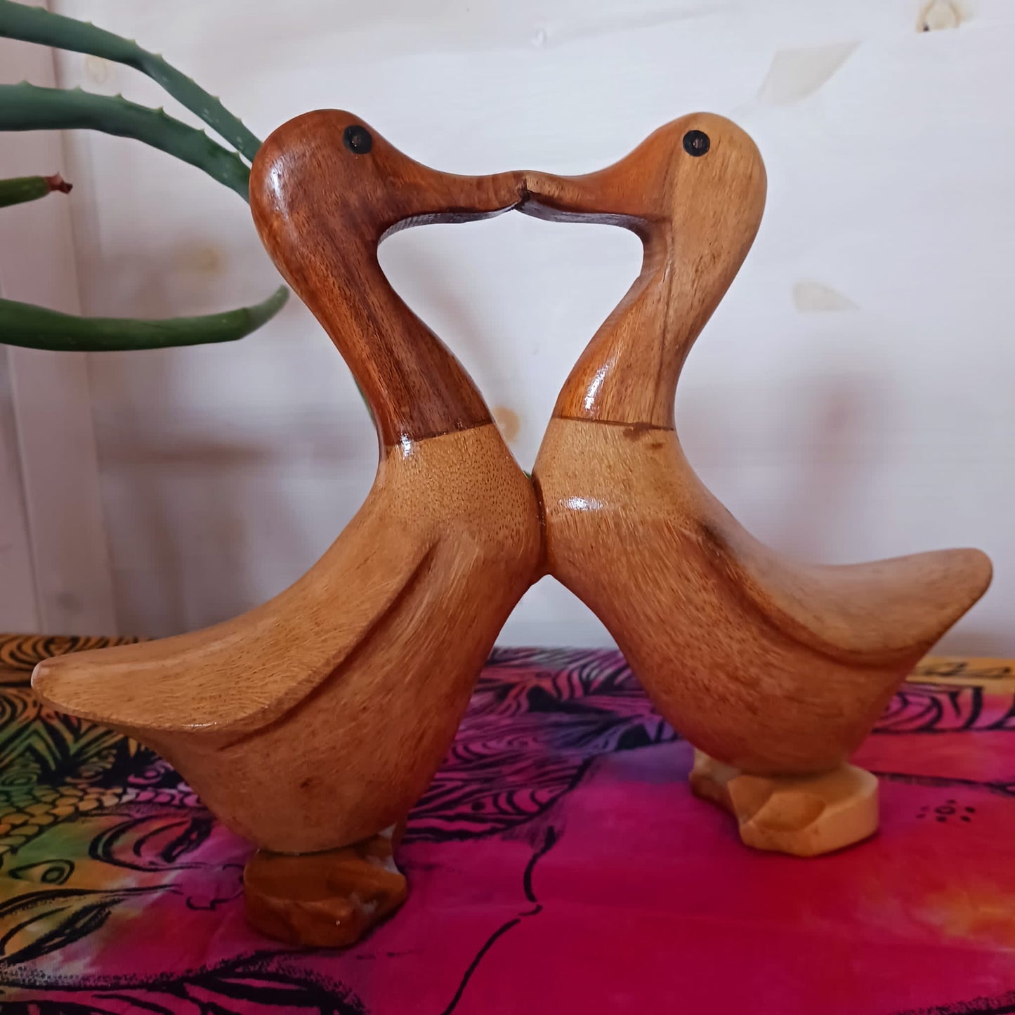 These joined pairs of ducks are carved from bamboo root in a charming beak to beak kiss. This cute little item is a perfect gift for nesting lovers.