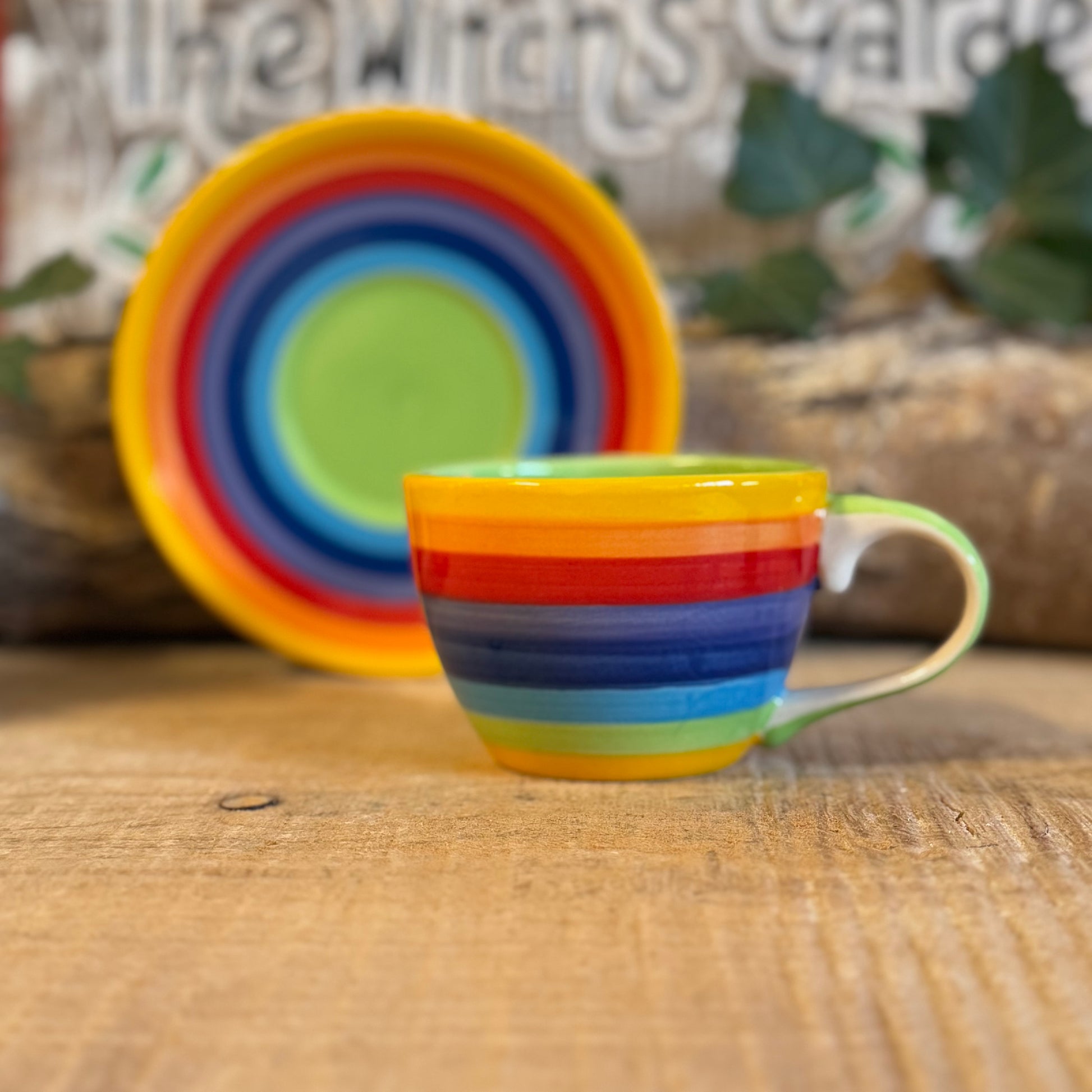 Enjoy your coffee in style with our handmade rainbow stripe ceramic cup & saucer. Fair-trade from Thailand, this vibrant, hand-painted set is dishwasher and microwave safe—perfect for brightening up any home.