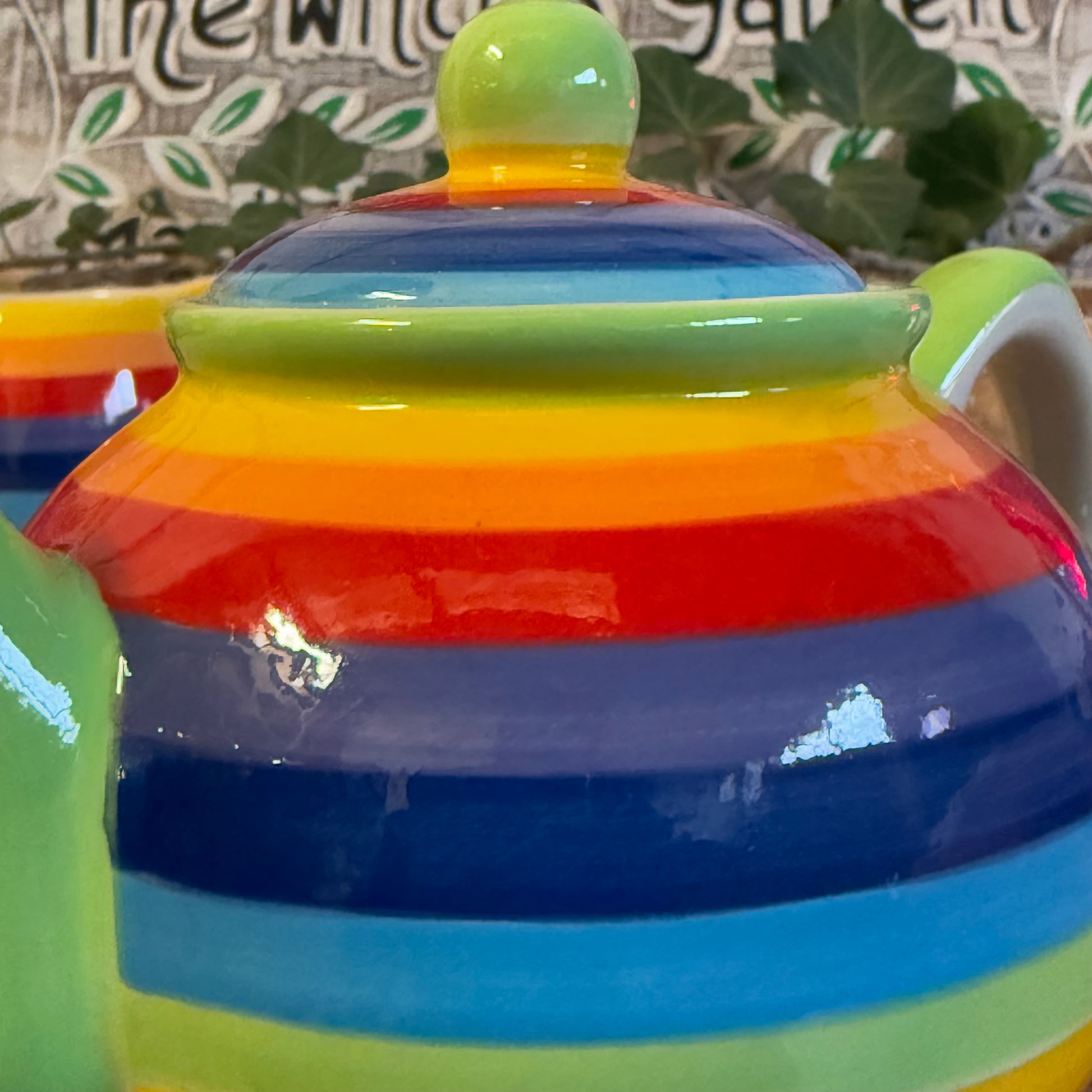 Discover our handcrafted 2-cup ceramic teapot from Thailand, featuring a vibrant rainbow design. Eco-friendly, fair-trade, dishwasher & microwave safe—perfect for elevating your tea rituals with style and sustainability.