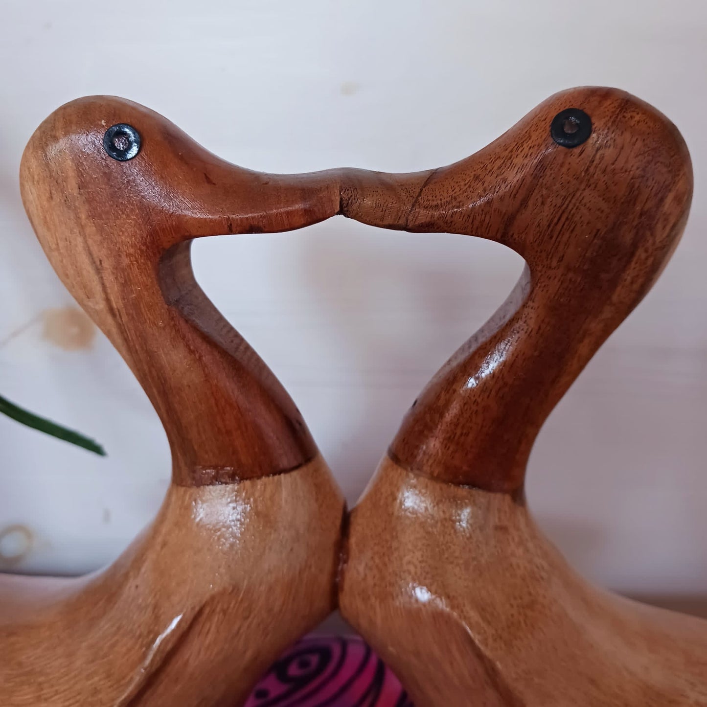 These joined pairs of ducks are carved from bamboo root in a charming beak to beak kiss. This cute little item is a perfect gift for nesting lovers.