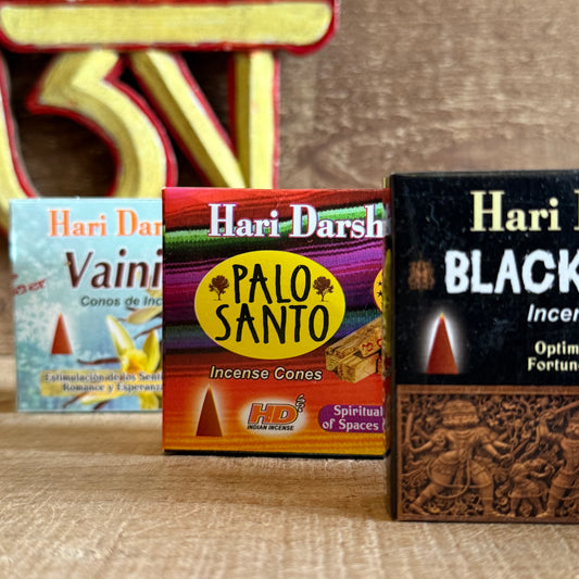 Invite calm, clarity, and sacred warmth into your home with the Hari Darshan Incense Cone Set, featuring three exquisite fragrances — Vanilla, Palo Santo, and Black Sandal. Handcrafted in Bangalore, India, by the renowned incense artisans Hari Darshan, this collection blends tradition, purity, and spiritual depth in every cone.