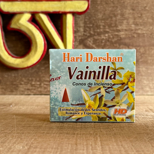 Embrace tranquility with Hari Darshan Vanilla Incense Cones, a soothing blend crafted in Bangalore, India, by one of the most respected traditional incense makers. Each cone releases the gentle, creamy sweetness of vanilla, filling your space with warmth and peace.

This comforting fragrance helps to calm the mind, ease stress, and create a serene environment ideal for meditation, relaxation, or evening rituals. As the soft smoke rises, it transforms your surroundings into a cocoon of calm energy and gentle