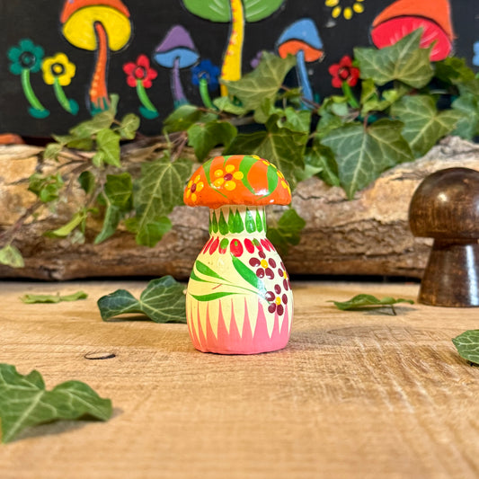 Bring a touch of nature’s charm into your home with our Hand Painted Wooden Mushroom Ornament. Each piece is lovingly crafted and painted by skilled artisans, transforming a simple wooden form into a joyful work of art. The mushroom’s delicate floral design and vibrant colours symbolise harmony, growth, and the beauty of simplicity.