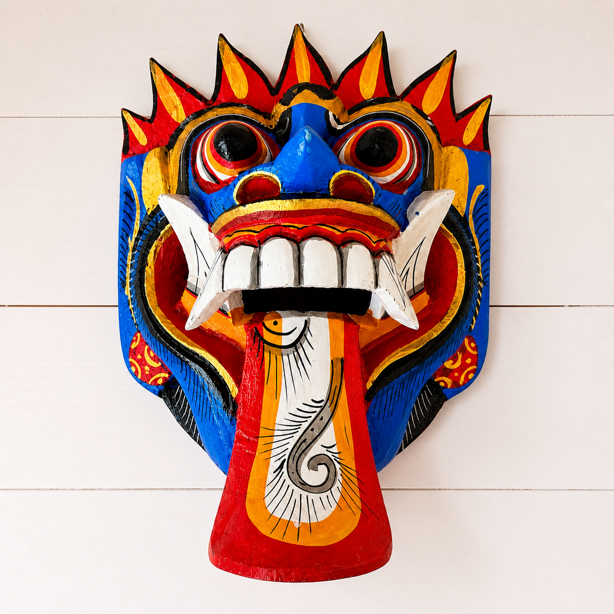 Hand carved Balinese Rangda Mask wall hanging featuring vibrant blue, red and gold colours, traditional tribal design and authentic Indonesian craftsmanship.