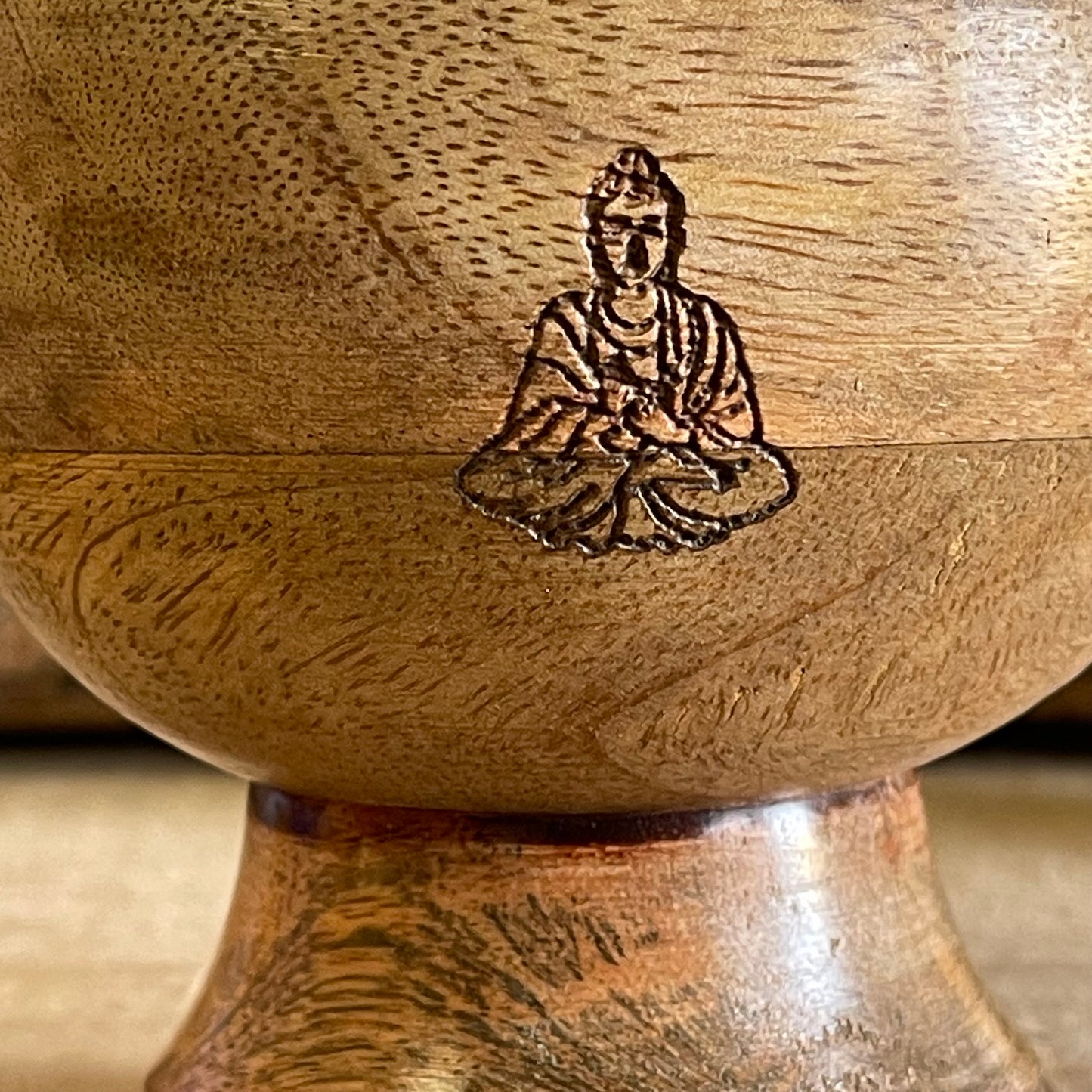 This incense holder boasts a compact and detailed design, with dimensions of 11 cm across and a 10 cm height. Its innovative design allows for the use of both incense sticks and cones, catering to a variety of incense rituals. The bowl-shaped holder showcases a delicately etched Buddha symbol on its interior, serving as a focal point and elevating its spiritual atmosphere. The meticulous engraving adds a touch of serenity, promoting a reflective and meditative atmosphere to any space. Perfect for altar sett