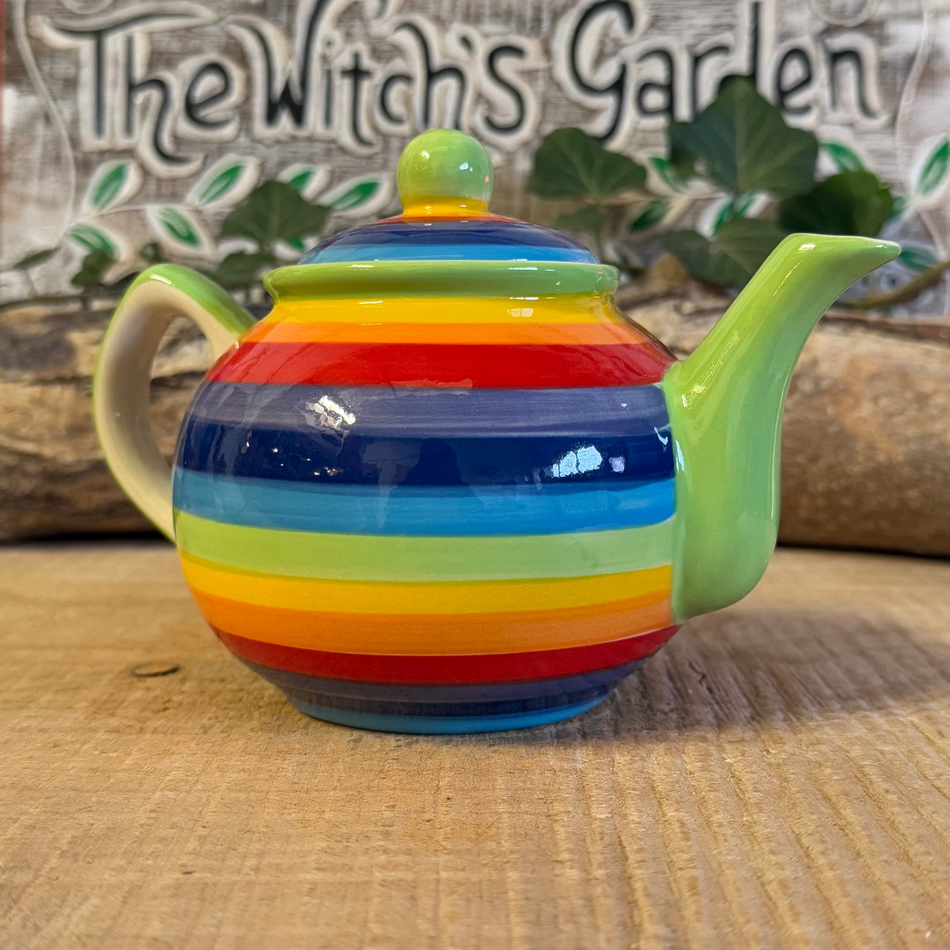 Discover our handcrafted 2-cup ceramic teapot from Thailand, featuring a vibrant rainbow design. Eco-friendly, fair-trade, dishwasher & microwave safe—perfect for elevating your tea rituals with style and sustainability.