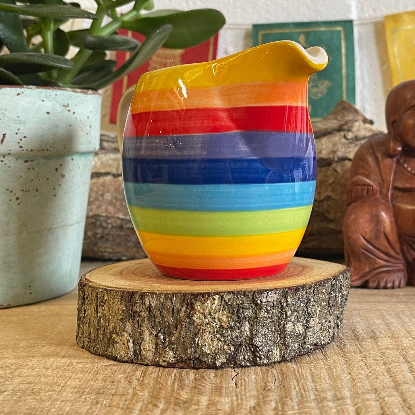 Hand painted rainbow stripe ceramic milk jug