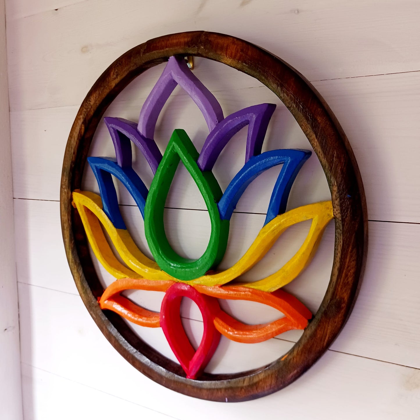 This stunning large lotus plaque will definitely add some colour to your home, perfect for your meditation room, home, office or as a gifts for family and friends. Hand painted in vibrant rainbow colours it creates a striking piece of wall art and comes with a handy hook for easy hanging.