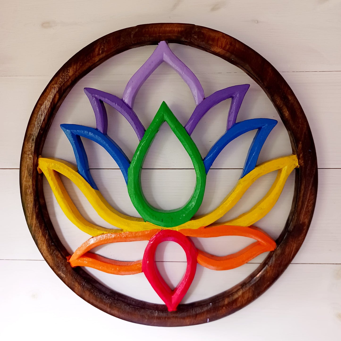 This stunning large lotus plaque will definitely add some colour to your home, perfect for your meditation room, home, office or as a gifts for family and friends. Hand painted in vibrant rainbow colours it creates a striking piece of wall art and comes with a handy hook for easy hanging.