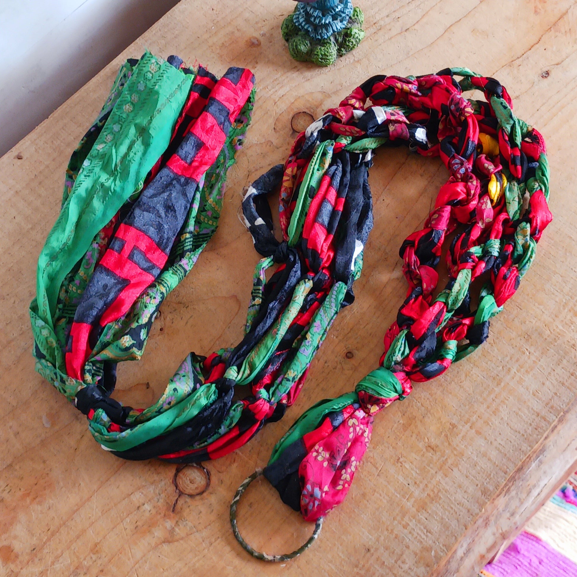 Add a burst of colour and a touch of boho charm to your home with these beautiful Large Recycled Sari Plant Hangers. Each hanger is handcrafted from upcycled sari fabric, giving new life to discarded textiles while ensuring no material goes to waste. Their simple yet elegant design allows them to complement any décor style, from minimal to eclectic. Featuring a sturdy metal ring for easy hanging, they are perfect for showcasing your favourite indoor plants in a sustainable and stylish way.