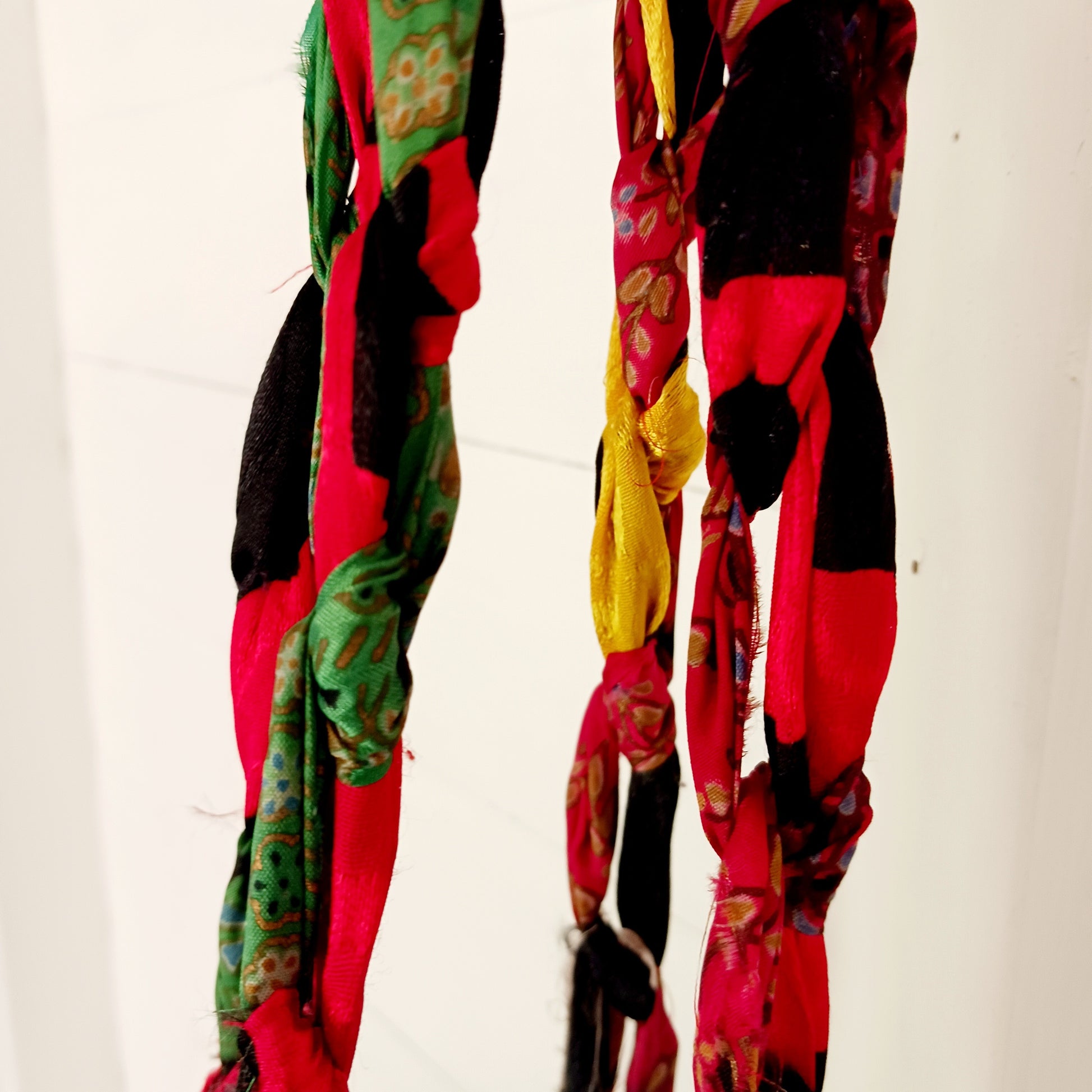 Add a burst of colour and a touch of boho charm to your home with these beautiful Large Recycled Sari Plant Hangers. Each hanger is handcrafted from upcycled sari fabric, giving new life to discarded textiles while ensuring no material goes to waste. Their simple yet elegant design allows them to complement any décor style, from minimal to eclectic. Featuring a sturdy metal ring for easy hanging, they are perfect for showcasing your favourite indoor plants in a sustainable and stylish way.