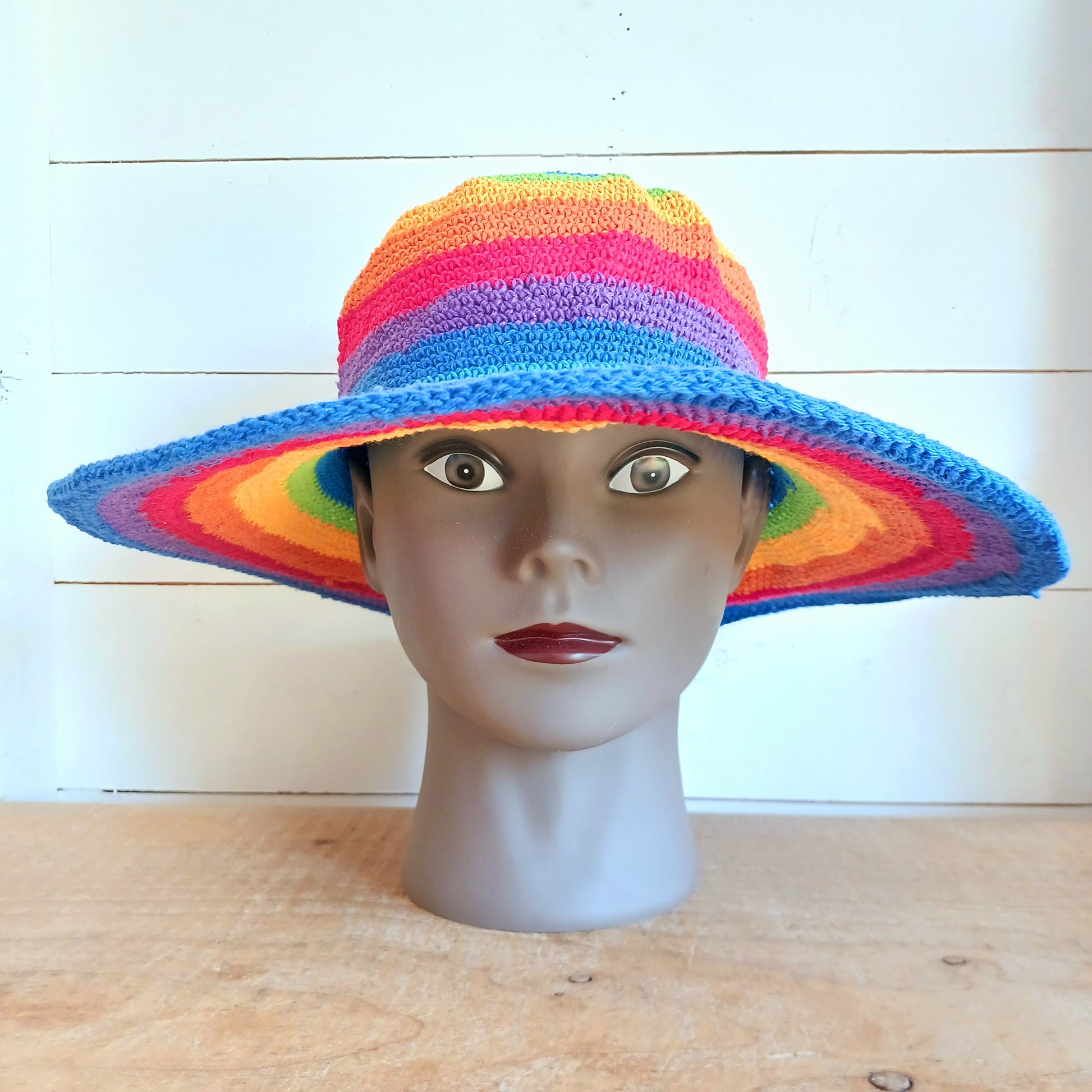 Add a splash of colour to your summer wardrobe with this beautiful Handmade Rainbow Crochet Cotton Sun Hat. Carefully handcrafted, this vibrant hat is designed to keep you comfortable while making a bold statement wherever your adventures take you.
