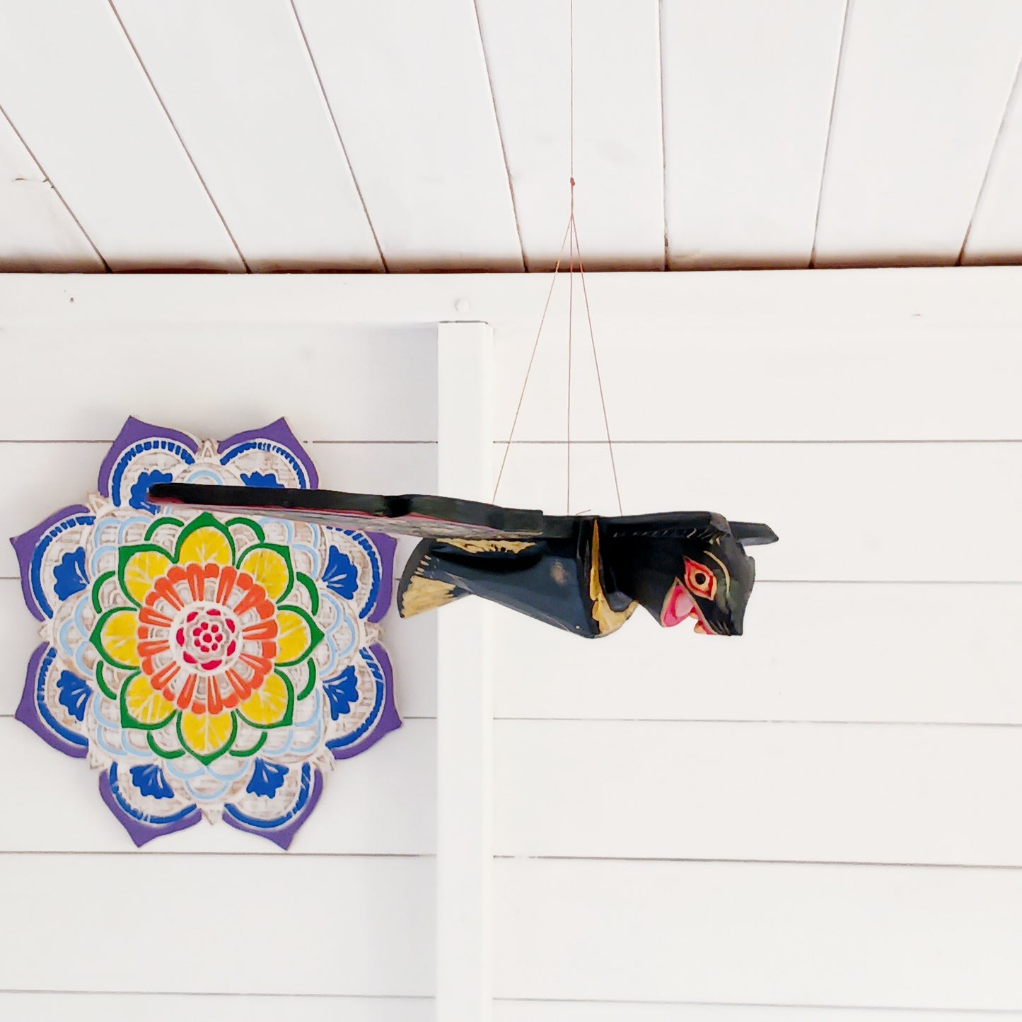 Bring a touch of gothic magic into your home with this striking hand-carved wooden flying bat mobile, handmade by skilled artisans in Bali, Indonesia. With its wings dramatically outstretched to approximately 50cm wide, this unusual hanging decoration makes a bold statement suspended from a ceiling, doorway, window or display area.