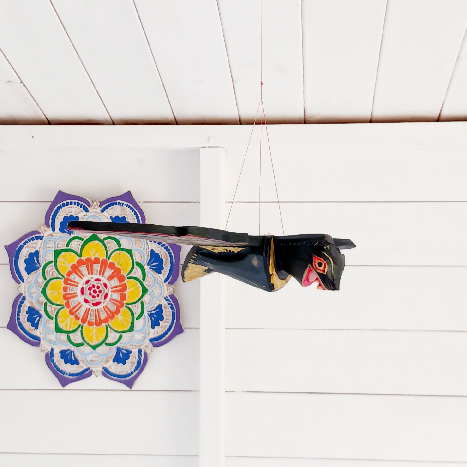 Bring a touch of gothic magic into your home with this striking hand-carved wooden flying bat mobile, handmade by skilled artisans in Bali, Indonesia. With its wings dramatically outstretched to approximately 50cm wide, this unusual hanging decoration makes a bold statement suspended from a ceiling, doorway, window or display area.