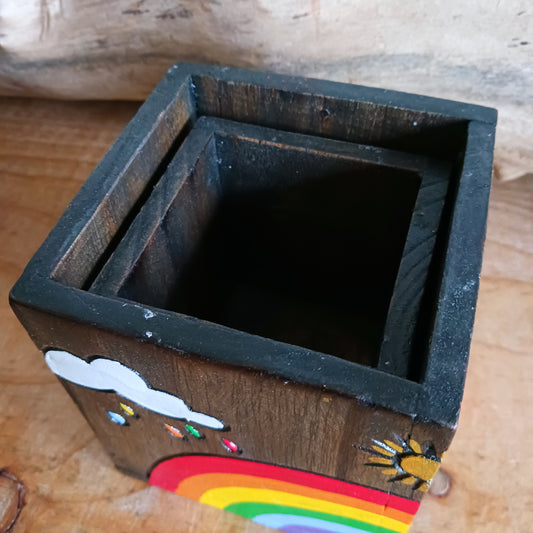 Add a burst of colour and joy to your space with this Hand Painted Rainbow Wooden Pots Set, handmade in Indonesia and Fairtrade certified. Each pot is carefully painted by skilled artisans, making every set unique and full of character.