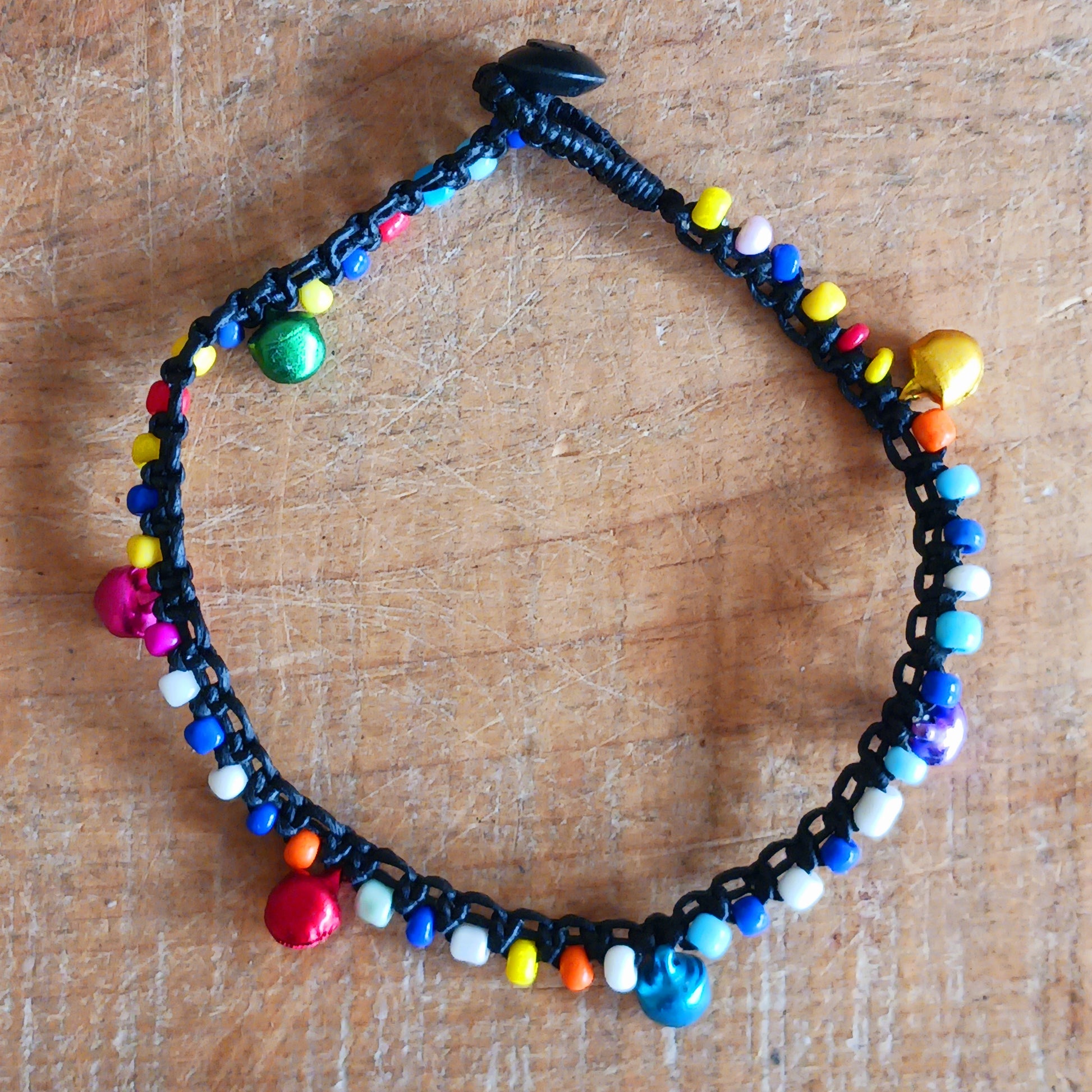 Add a playful touch to your look with these beautifully handmade Fairtrade jingle anklets from Thailand. Designed to bring both style and charm, each anklet features vibrant colours that instantly brighten any outfit.