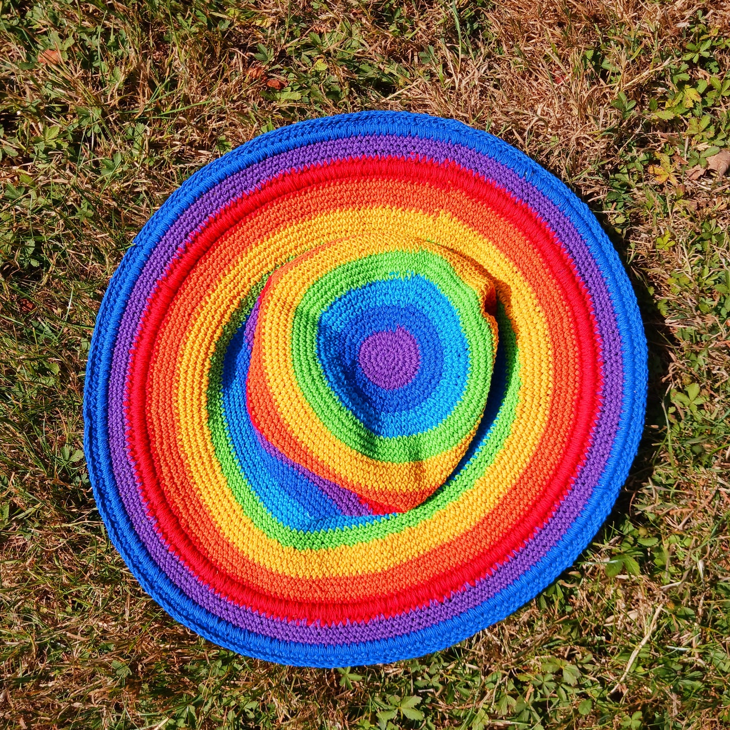 Add a splash of colour to your summer wardrobe with this beautiful Handmade Rainbow Crochet Cotton Sun Hat. Carefully handcrafted, this vibrant hat is designed to keep you comfortable while making a bold statement wherever your adventures take you.