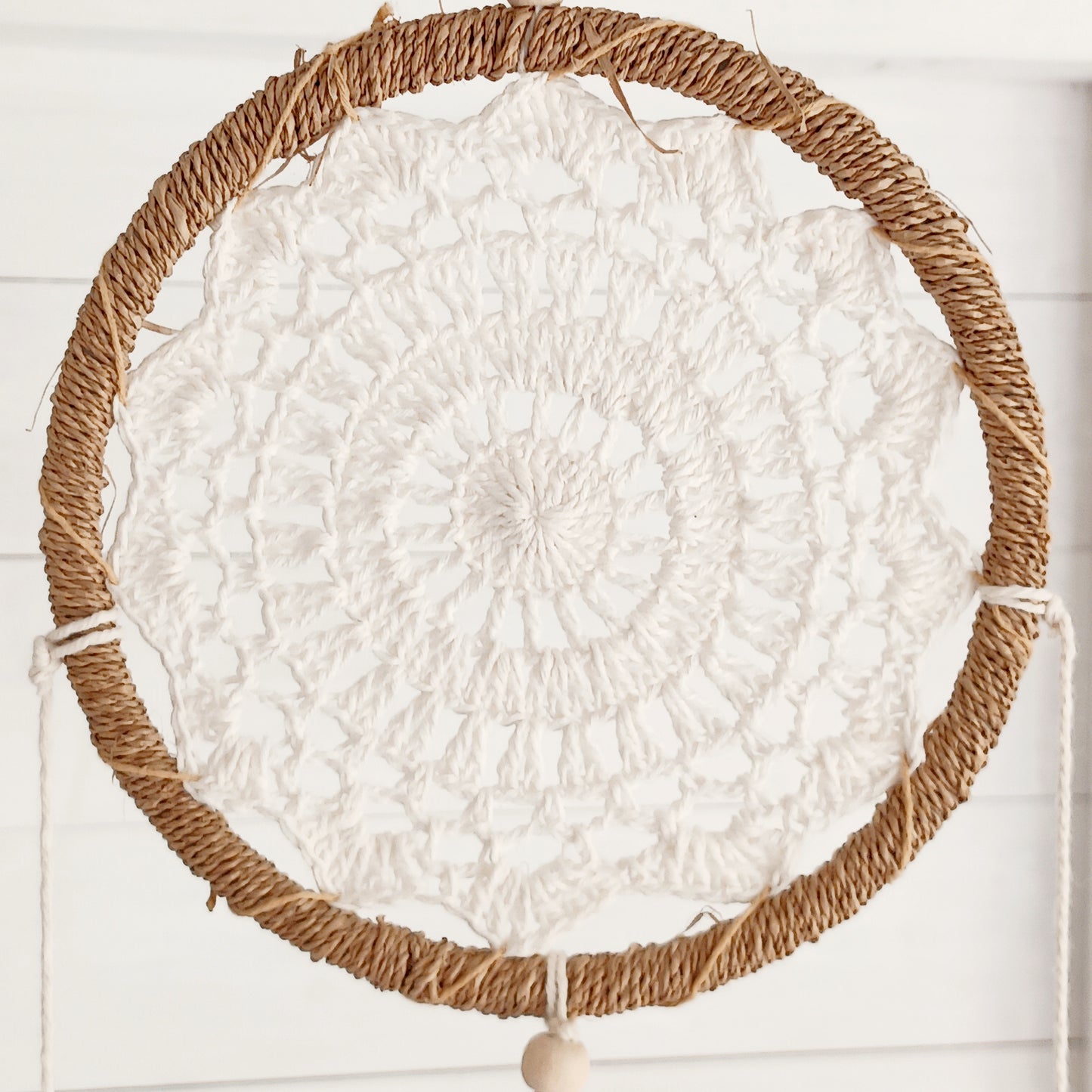 Bring peace, balance, and natural elegance into your home with this handmade Medium Natural Elemental Spirits Dream Catcher. Crafted with love and care on the spiritually blessed island of Bali, this vegan-friendly piece is made entirely from natural materials, free of feathers. Its earthy tones and organic textures create a warm and grounding presence, perfect for bedrooms, meditation spaces, or as a thoughtful gift.
