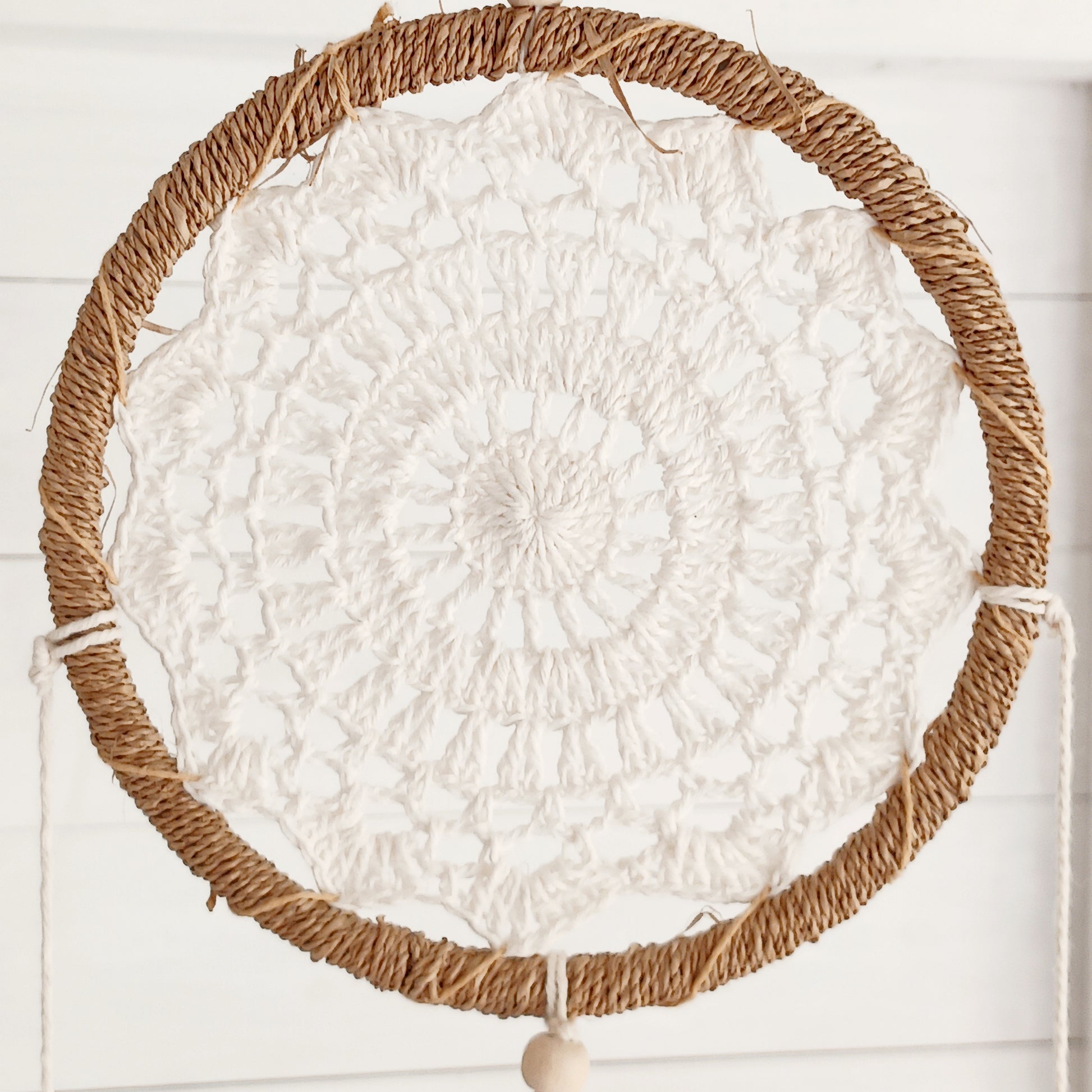 Bring peace, balance, and natural elegance into your home with this handmade Medium Natural Elemental Spirits Dream Catcher. Crafted with love and care on the spiritually blessed island of Bali, this vegan-friendly piece is made entirely from natural materials, free of feathers. Its earthy tones and organic textures create a warm and grounding presence, perfect for bedrooms, meditation spaces, or as a thoughtful gift.