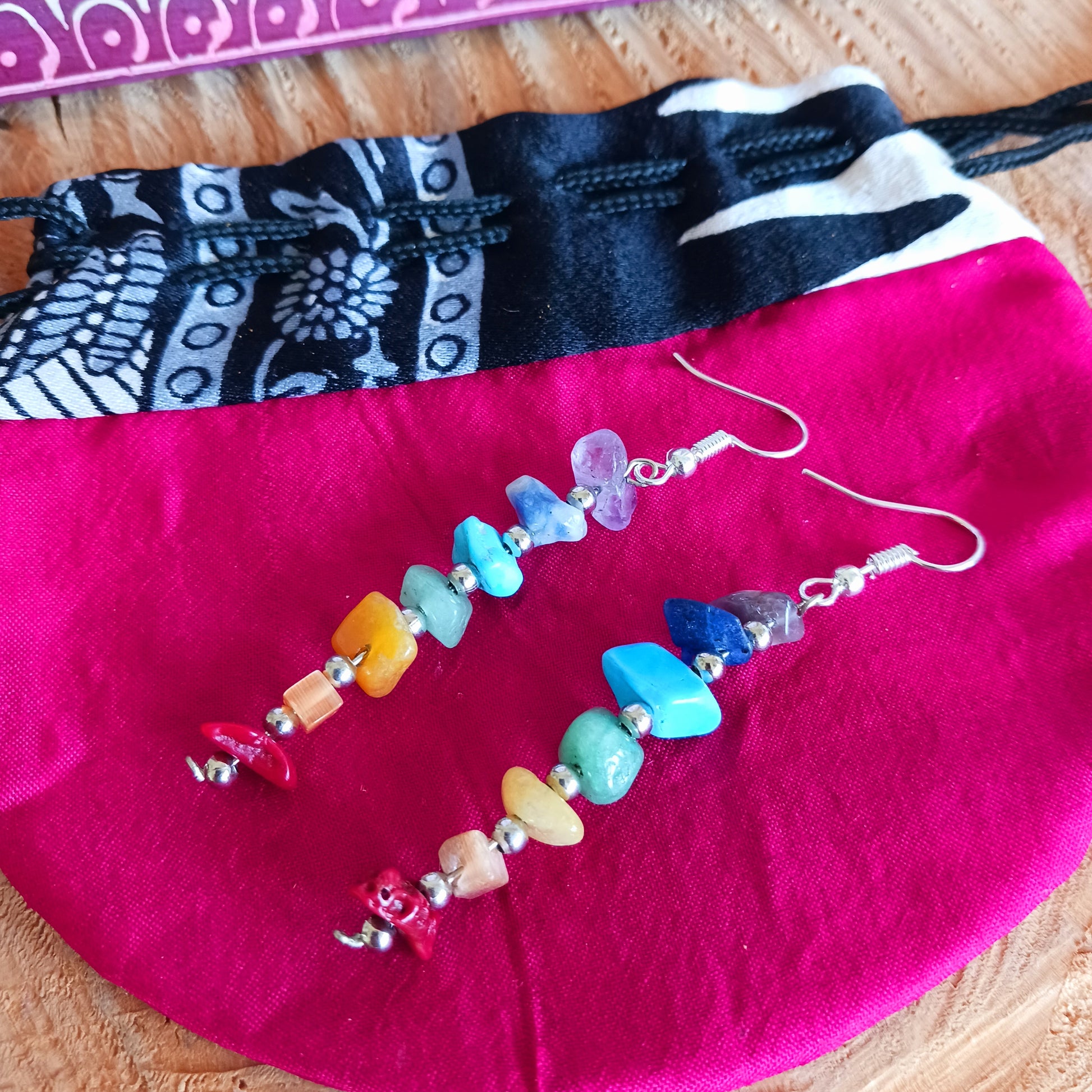 These brightly coloured earrings are made from seven gemstones, each representing one of the seven chakras. 
 Ideal for adding to your boho look and keeping you balanced on a night out.