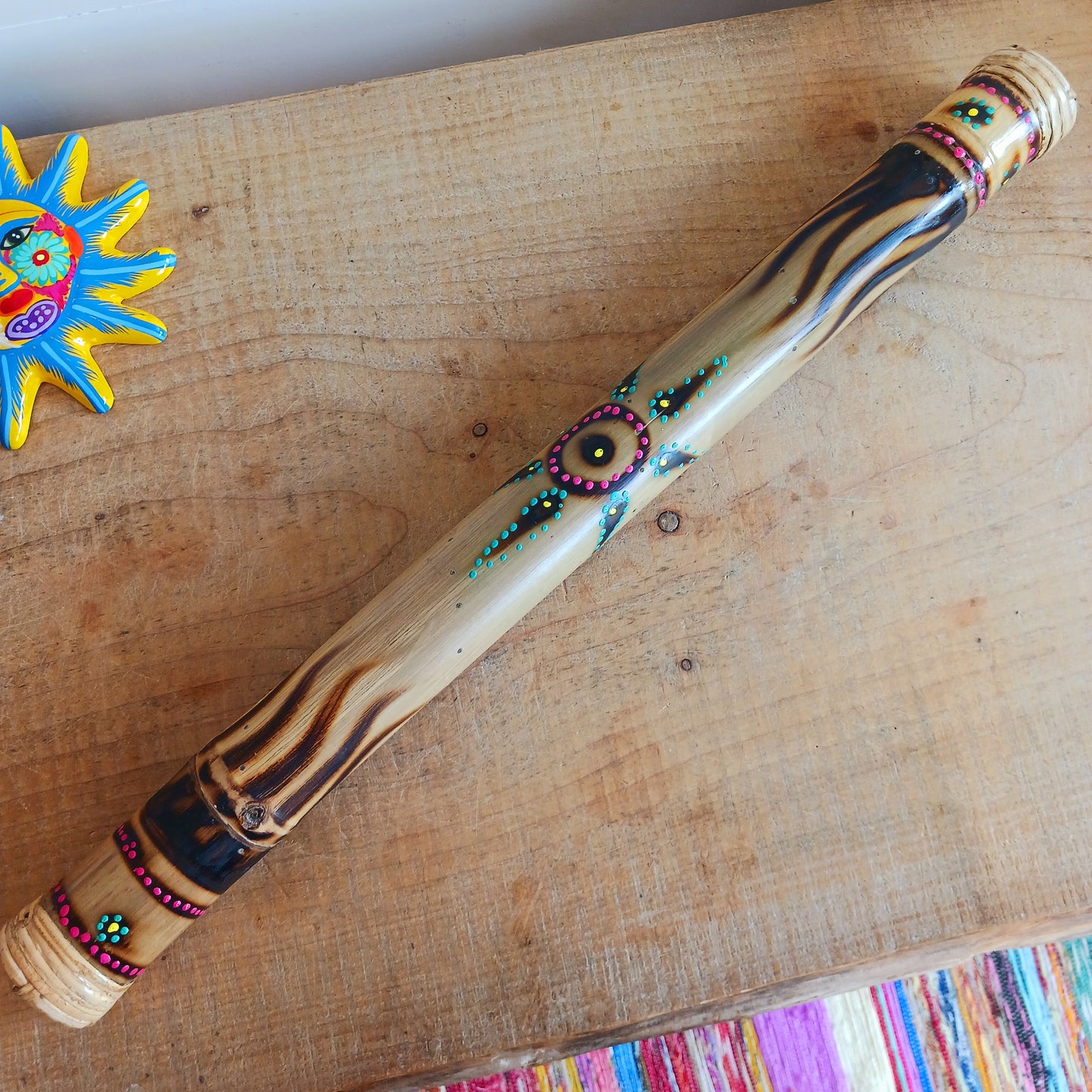 Bring the soothing sound of rainfall into your home with this beautifully handcrafted bamboo rainstick. Made using a hollow length of natural bamboo, this traditional percussion instrument creates a calming rain-like sound effect that is perfect for meditation, sound healing, relaxation, music sessions, classrooms, or unique home décor.