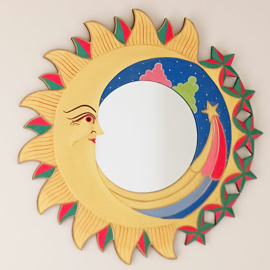 Bring the cosmos into your home with this beautifully handcrafted Sky Mirror, a unique and stunning wooden mirror adorned with intricate carvings of the sun, moon, and stars. Each piece is meticulously created by skilled artisans, ensuring fairtrade practices and exceptional quality. This celestial-inspired décor adds warmth, character, and a mystical charm to any room — perfect for those who love unique, meaningful home accents.