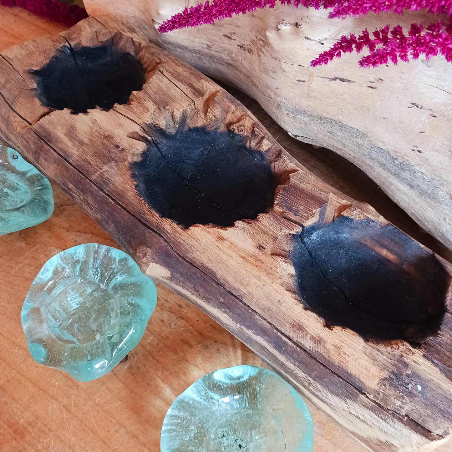 Bring nature into your home with this stunning handmade melted glass candle holder crafted in Bali. Each piece is truly one-of-a-kind, made from recycled glass hand-blown over whitewashed Balinese Gamal wood. As the molten glass cools, it moulds perfectly to the shape of the natural wood root, creating a unique balance of earthy and chic design. 