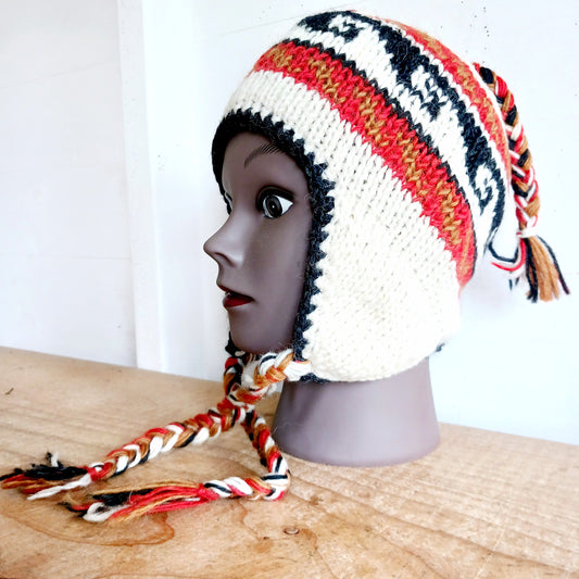 Stay cozy and stylish with our handmade chunky wool earflap hats, crafted in Nepal by skilled women artisans in Kathmandu. Each hat is 100% pure wool and features a soft polar fleece lining for extra warmth and comfort. Perfect for cold winter days, outdoor adventures, or adding a touch of handmade charm to your look.
