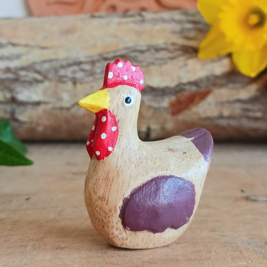 Add a touch of countryside charm to your home with this rustic mini wooden chicken ornament. Hand carved from sustainable Jempinis wood by skilled artisans in Indonesia, each piece is carefully painted in a rustic farmyard style that highlights the natural character of the wood.