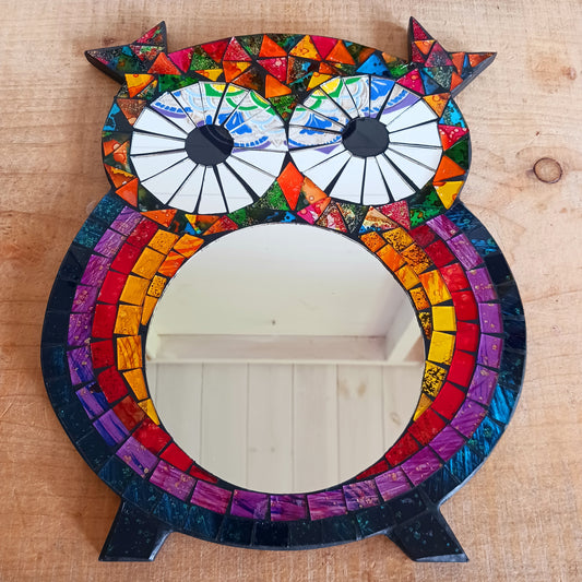 Bring colour, charm, and character to your home with this beautiful Sweet Mosaic Owl Mirror. Handcrafted under fair trade practices, this unique piece features a vibrant, multi-coloured mosaic owl surrounding a functional mirror. Perfect for brightening hallways, bedrooms, or living spaces, this decorative mirror blends artistry with practicality.