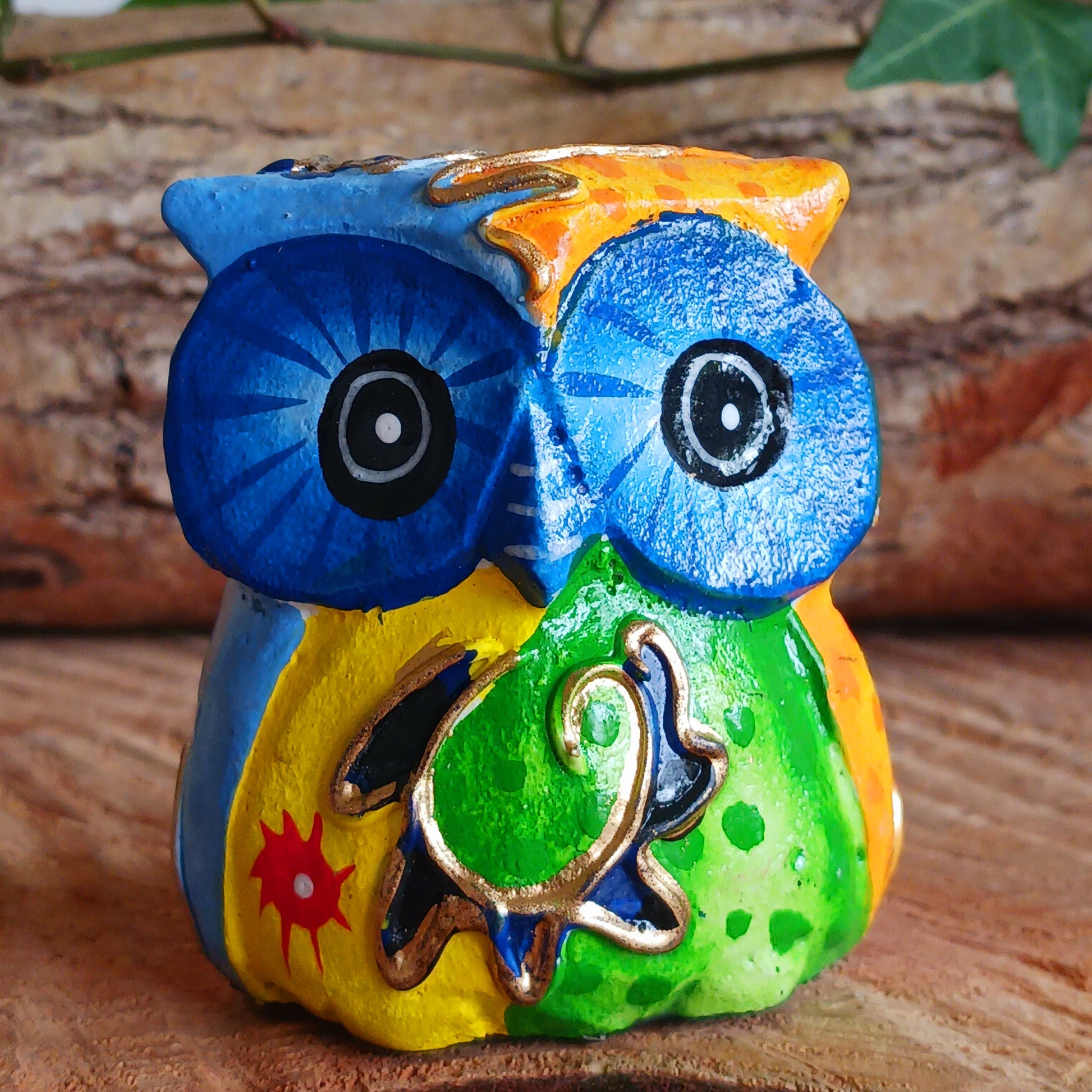 Add a pop of colour to your home décor with these beautifully hand painted Psychedelic Owls. These vibrant and quirky owl figurines instantly brighten any room with their playful charm.