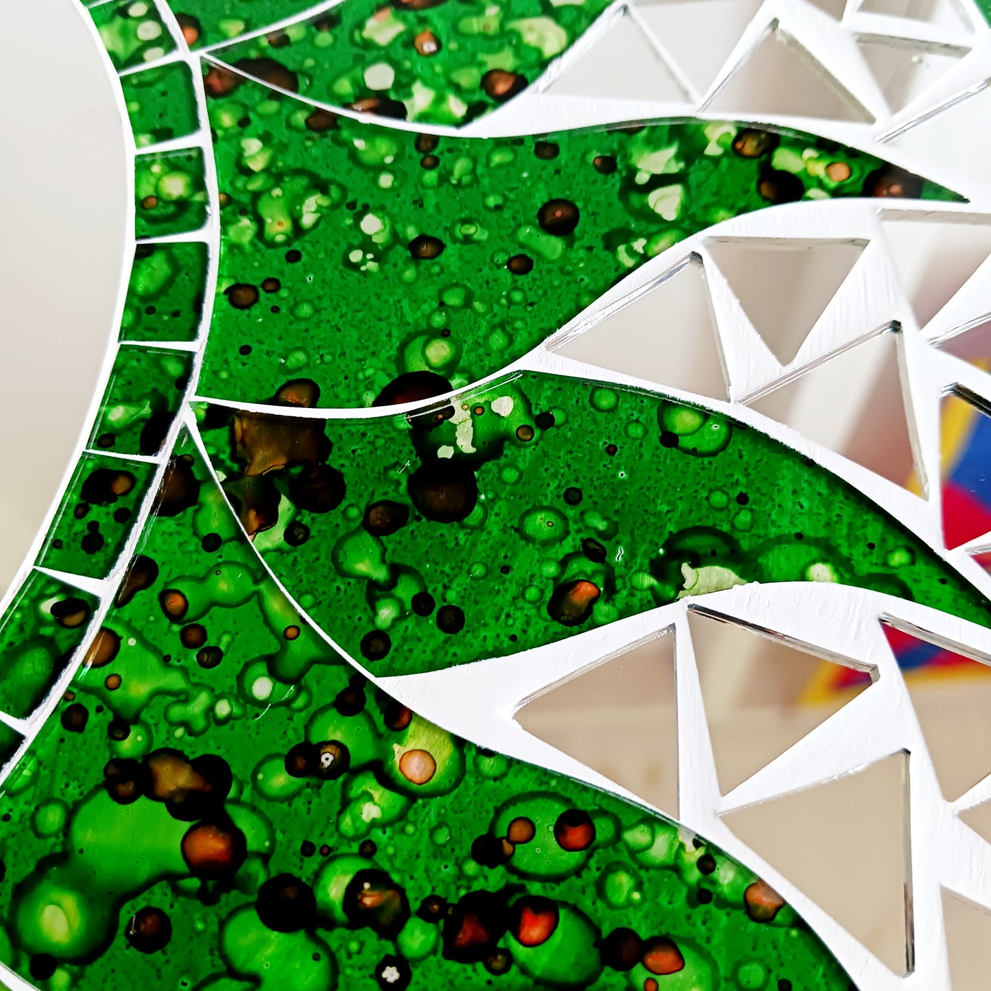 Add warmth, energy, and artistic charm to your home with this beautiful Vibrant Green Mosaic Sun Mirror. Designed with dazzling green mosaic tiles arranged in a radiant sunburst pattern, this captivating wall accent instantly brightens any room.