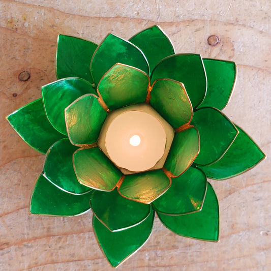 The Lotus Flower is a symbol of achieving enlightenment, peacefulness and spirituality. This beautiful candle holder can be fitted with tealight candles or slightly larger candles. The diameter of the middle is roughly 5.5cm, so it will fit any candle with the same diameter.