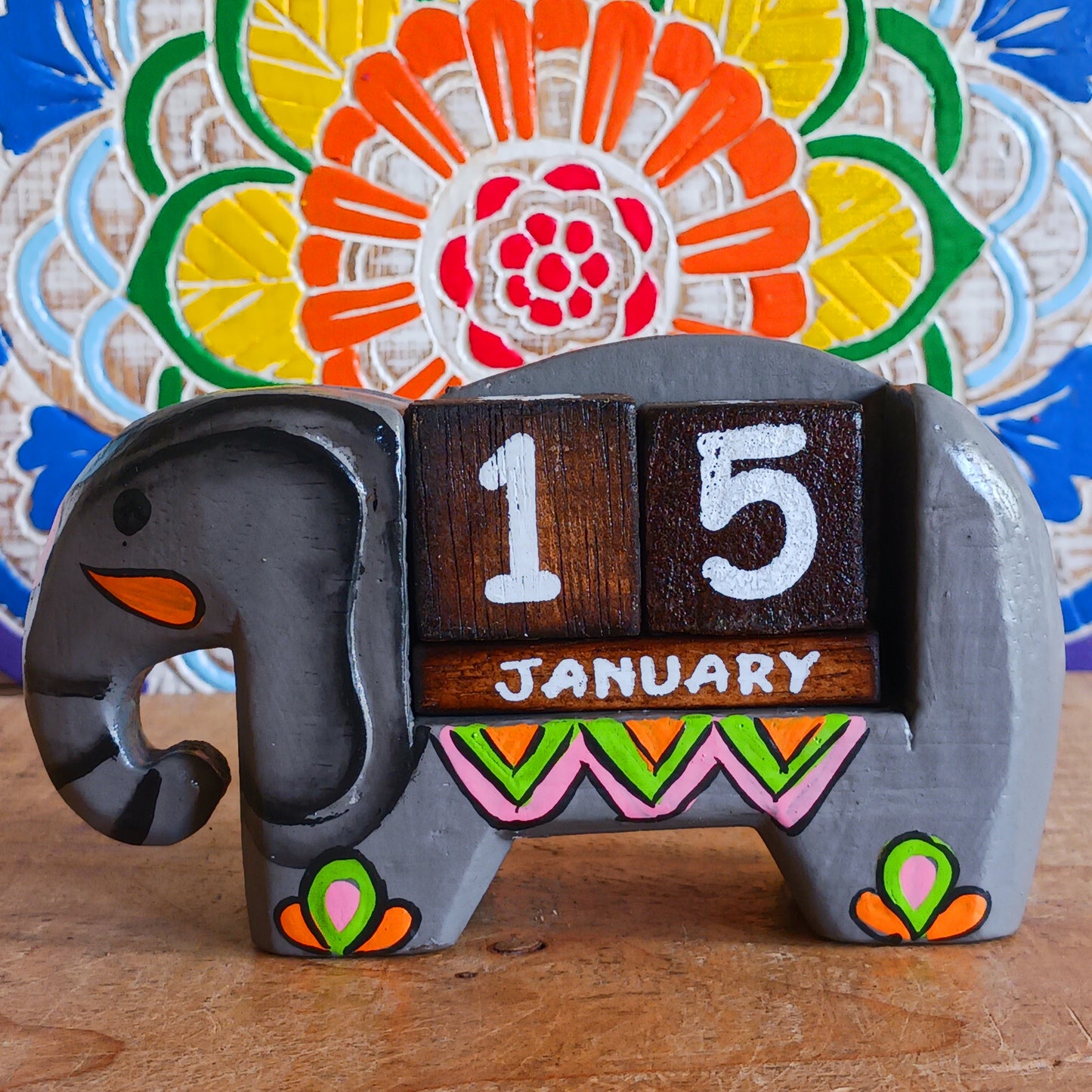 Brighten up your desk with this charming hand-painted wooden elephant calendar! This cheerful desk-buddy is both practical and eco-friendly, making it a perfect addition to your work or study space. Simply rotate the wooden blocks each day to keep track of the date – no need to replace it year after year. A thoughtful, sustainable gift for elephant lovers, students, or anyone who enjoys unique handcrafted décor.