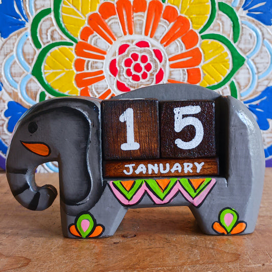 Brighten up your desk with this charming hand-painted wooden elephant calendar! This cheerful desk-buddy is both practical and eco-friendly, making it a perfect addition to your work or study space. Simply rotate the wooden blocks each day to keep track of the date – no need to replace it year after year. A thoughtful, sustainable gift for elephant lovers, students, or anyone who enjoys unique handcrafted décor.
