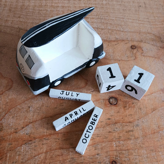 Bring the feeling of endless summer into your space with this cute black and white Camper & Surfboard Perpetual Calendar. Featuring a retro-inspired camper with a surfboard on top, this design captures the spirit of freedom, adventure, and life on the open road.