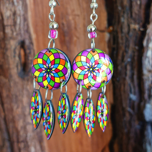 Colourful hippie style earrings featuring a vibrant mandala pattern design. Each pair is handmade in Peru and finished with silver plated hooks. Ideal for a night out or for dressing up your unique boho look!
