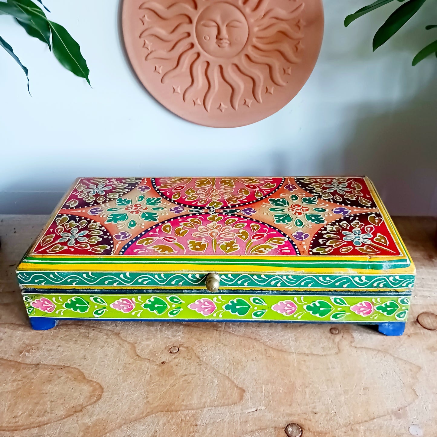Add charm and colour to your space with this beautifully handmade and hand-painted wooden jewellery box featuring a vibrant lime and floral pattern.