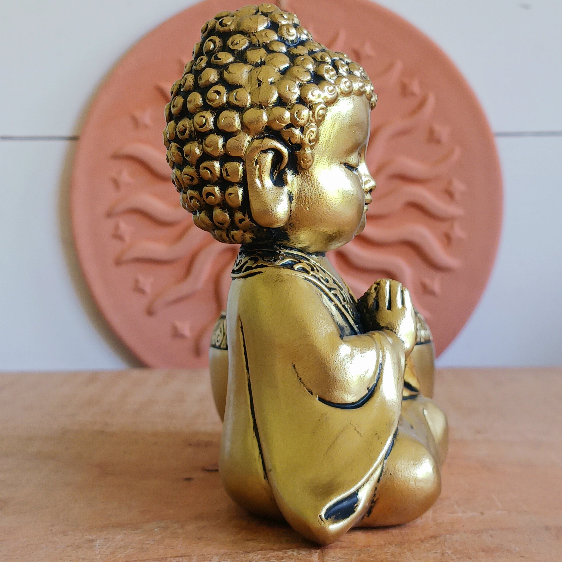 Bring a sense of peace and mindfulness into your home with this elegant Gold Buddha Tealight Candle Holder. Featuring a beautifully crafted praying Buddha figure alongside a tealight holder, this decorative piece creates a calming ambiance wherever it is placed.