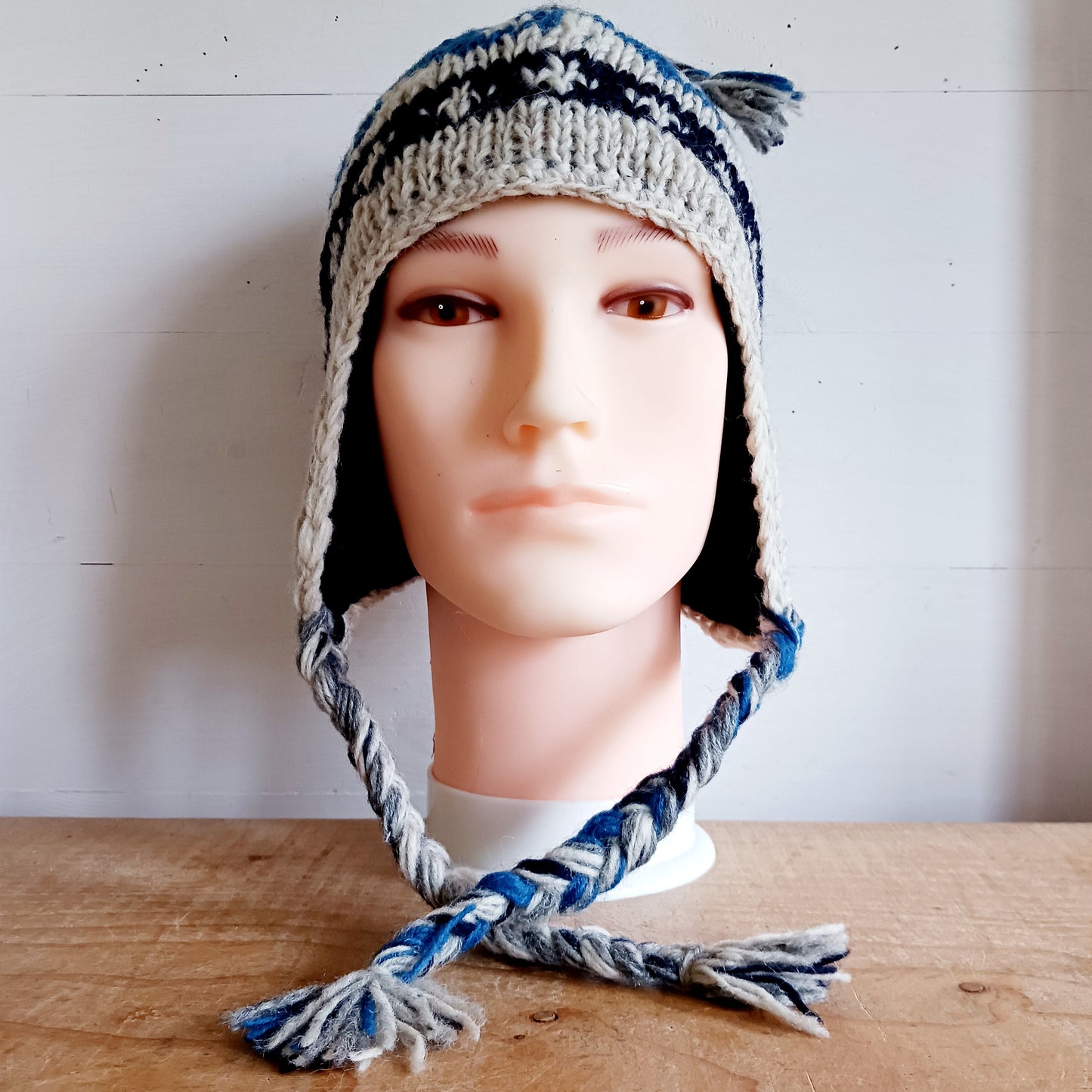 Stay cozy and stylish with our handmade chunky wool earflap hats, crafted in Nepal by skilled women artisans in Kathmandu. Each hat is 100% pure wool and features a soft polar fleece lining for extra warmth and comfort. Perfect for cold winter days, outdoor adventures, or adding a touch of handmade charm to your look.
