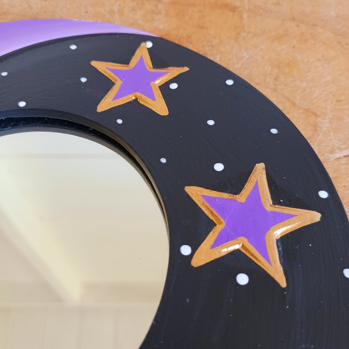 Bring celestial charm and positive energy into your home with this little Handmade Purple Moon Mirror. Carefully crafted by Fair Trade artisans, this unique decorative mirror features a stunning purple crescent moon design that adds a mystical and spiritual touch to any room.