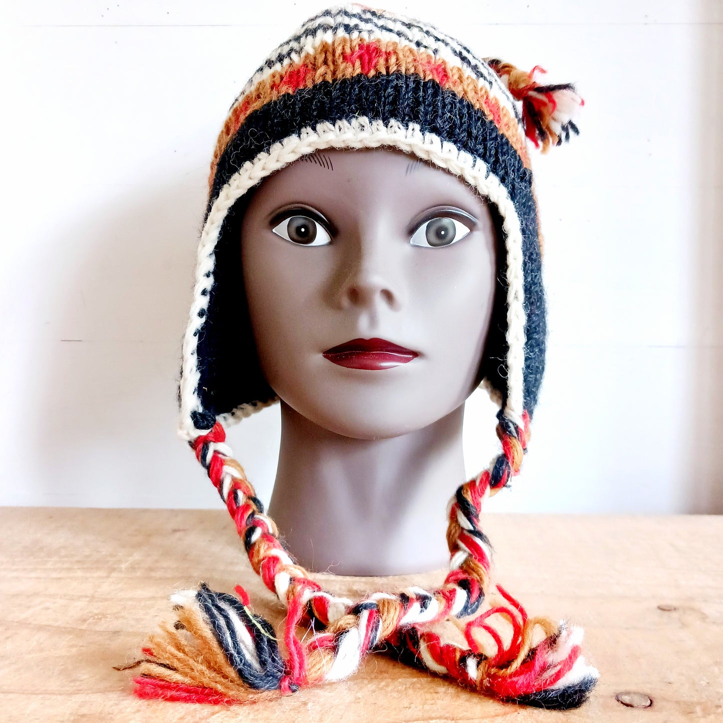 Stay cozy and stylish with our handmade chunky wool earflap hats, crafted in Nepal by skilled women artisans in Kathmandu. Each hat is 100% pure wool and features a soft polar fleece lining for extra warmth and comfort. Perfect for cold winter days, outdoor adventures, or adding a touch of handmade charm to your look.