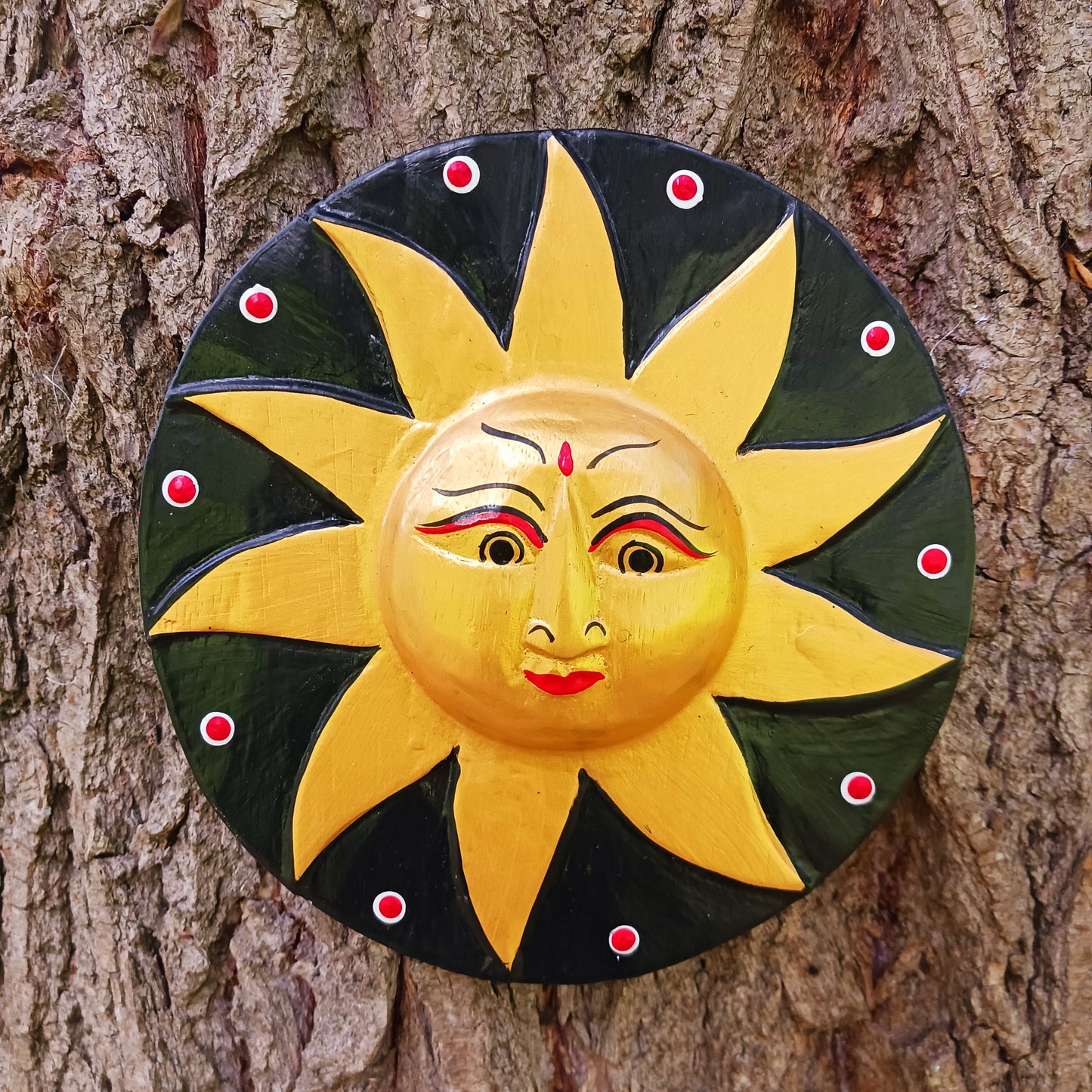 Bring a burst of sunshine into your home with this Black and Gold Sun Plaque, lovingly hand-carved in Bali from sustainably sourced wood. Each plaque features a radiant sun face surrounded by detailed rays, symbolizing warmth, vitality, and the cycles of life.
