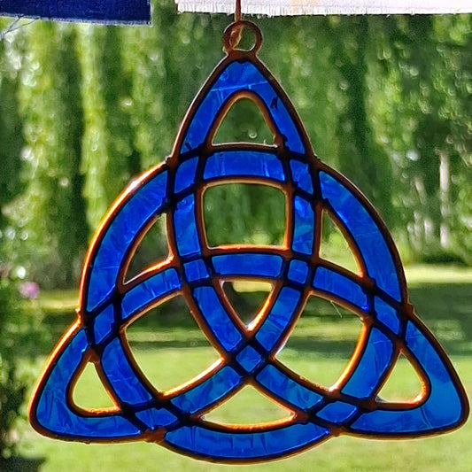 Invite the mystical energy of nature into the home with this little pagan suncatcher featuring a traditional triquetra design. Handcrafted in Bali, this enchanting piece is sure to infuse any space with a touch of earthly charm.