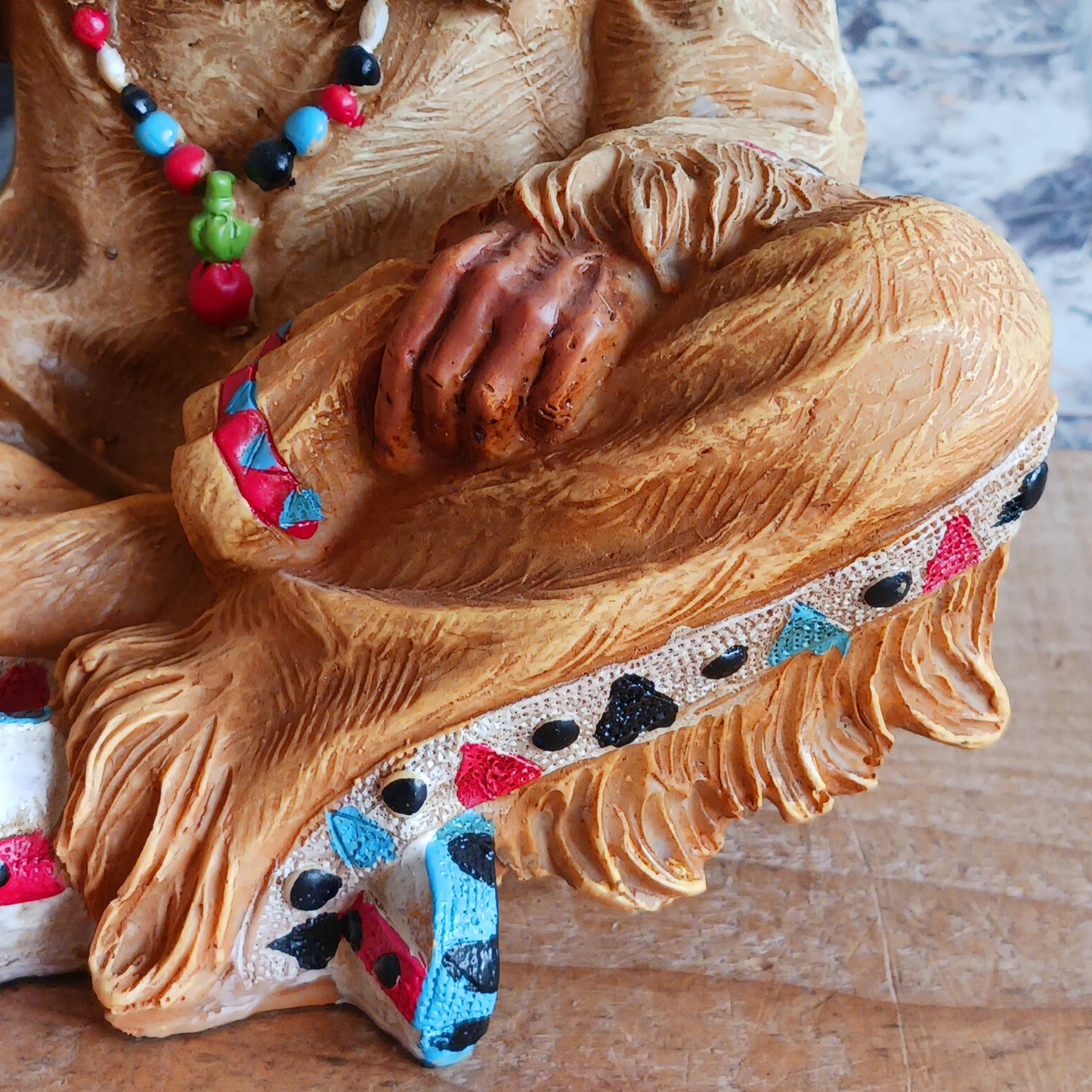 Elevate your space with the serene elegance of this Native American Chief Smoking a Peace Pipe figurine, a captivating symbol of wisdom and cultural harmony. Expertly crafted with intricate detail, this masterpiece depicts a noble chief in traditional tribal attire, smoking a symbolic peace pipe with grace and dignity. From the regal feathered headdress to the delicate carving of the pipe, every element reflects the artistry and cultural depth of Native American traditions. 