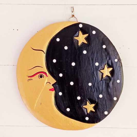 Bring celestial charm and mystical elegance into your space with this Black and Gold Moon Plaque. Hand-carved by skilled Balinese artisans from sustainably sourced wood, this stunning wall piece pairs the gentle energy of the moon with a dramatic black and gold colour palette.