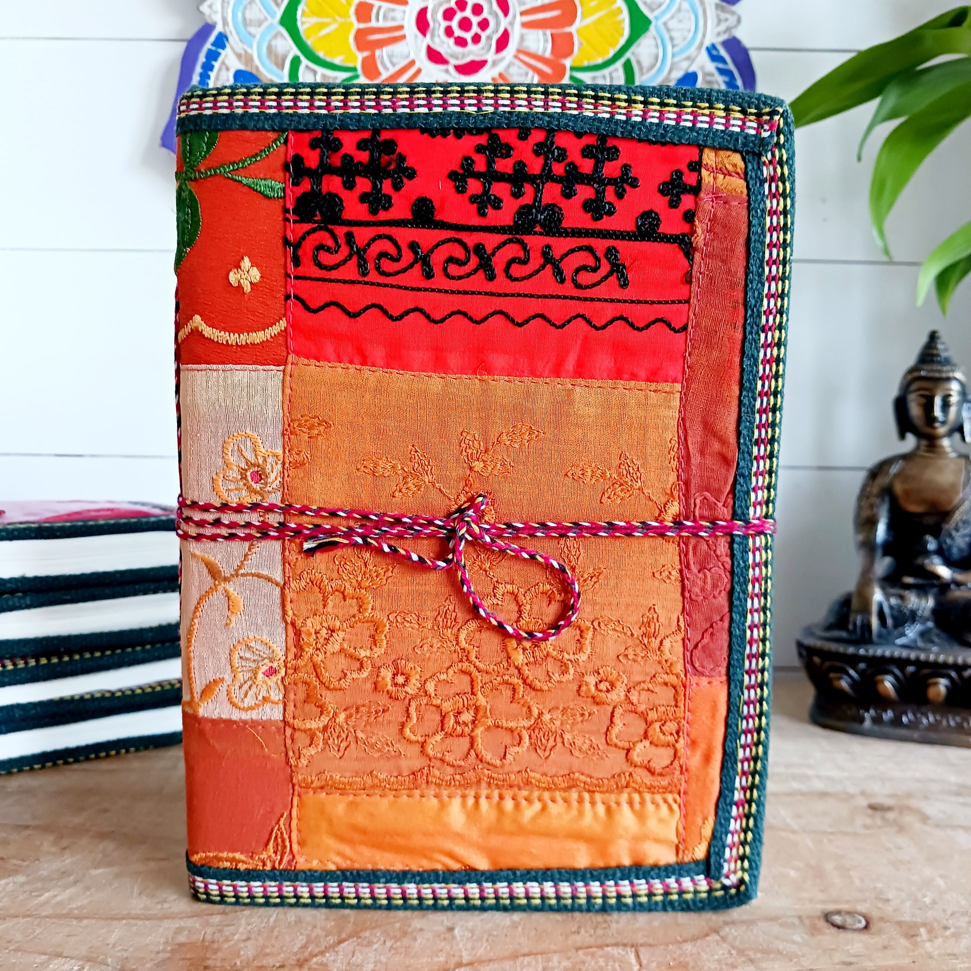 This beautifully bound notebook with handmade paper is from recycled cotton.  An imaginative use for sari offcut material, the cover is edged and framed with pretty brocade material to complete a lovely and unique eco friendly stationery gift.